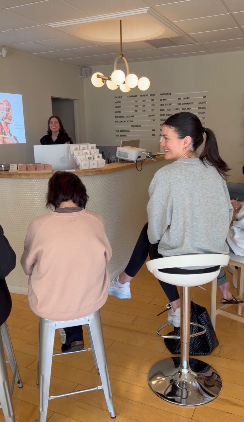 Students learning at the TEMPLE front desk during a reception training session
