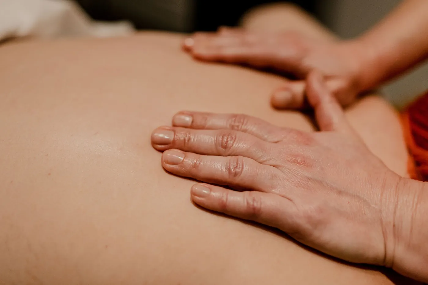 Licensed massage therapist giving a back massage at TEMPLE in Savannah